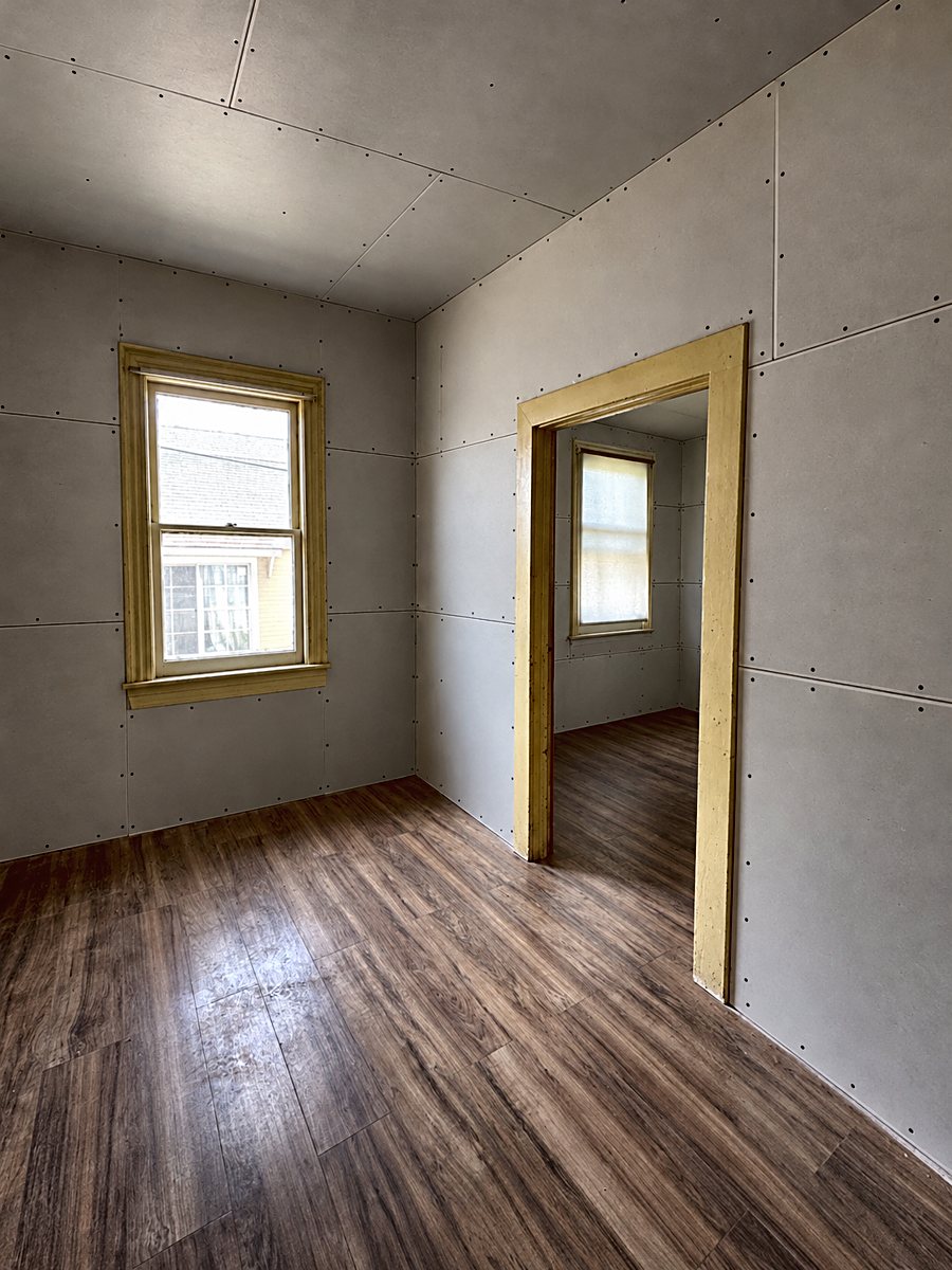 Room 4: installed drywall panels with taped seams