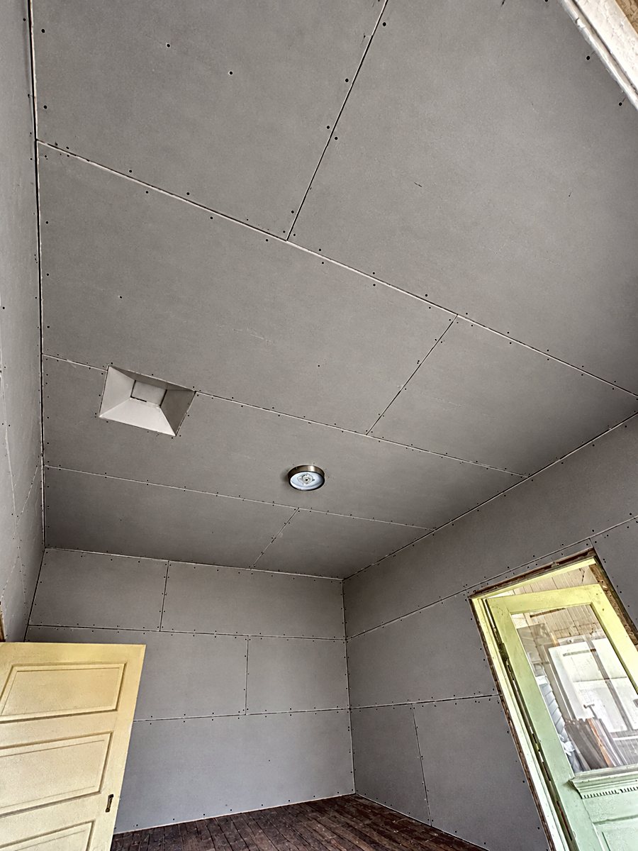 Room 1: installed drywall panels with taped seams