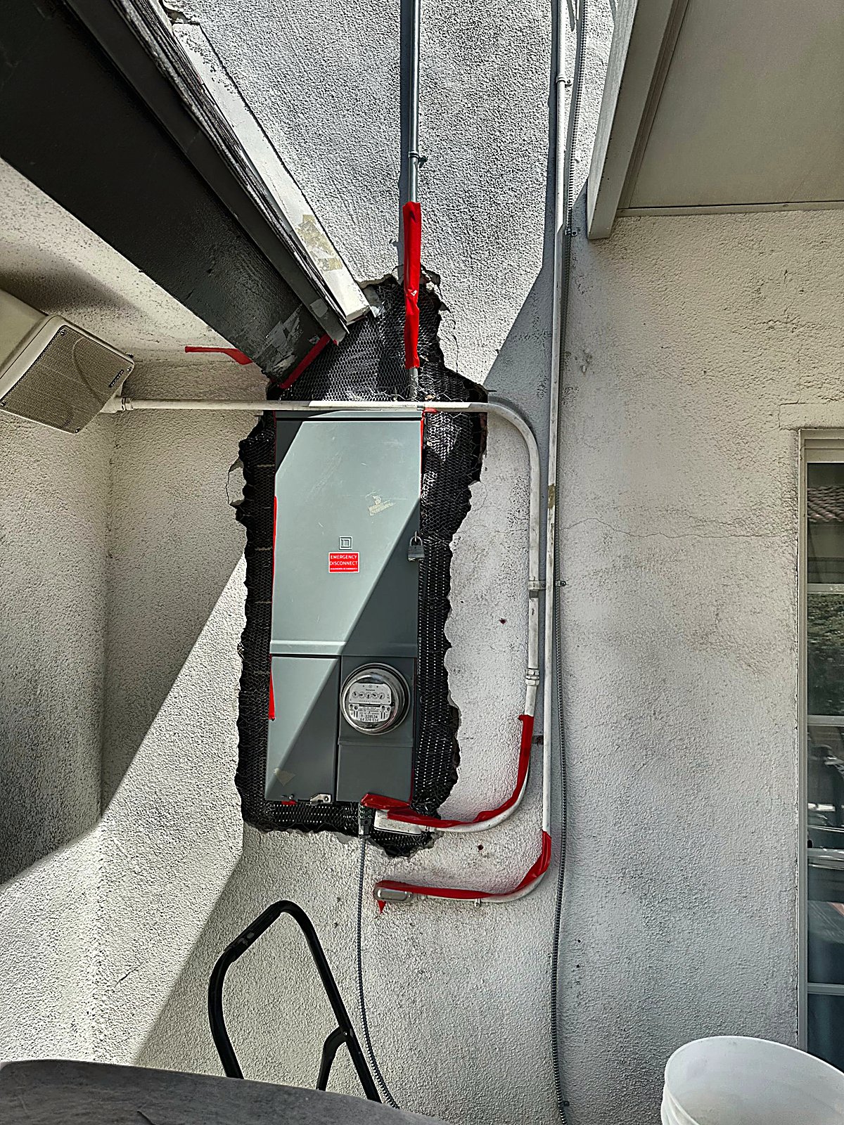 Wire lath installed in the white wall panel