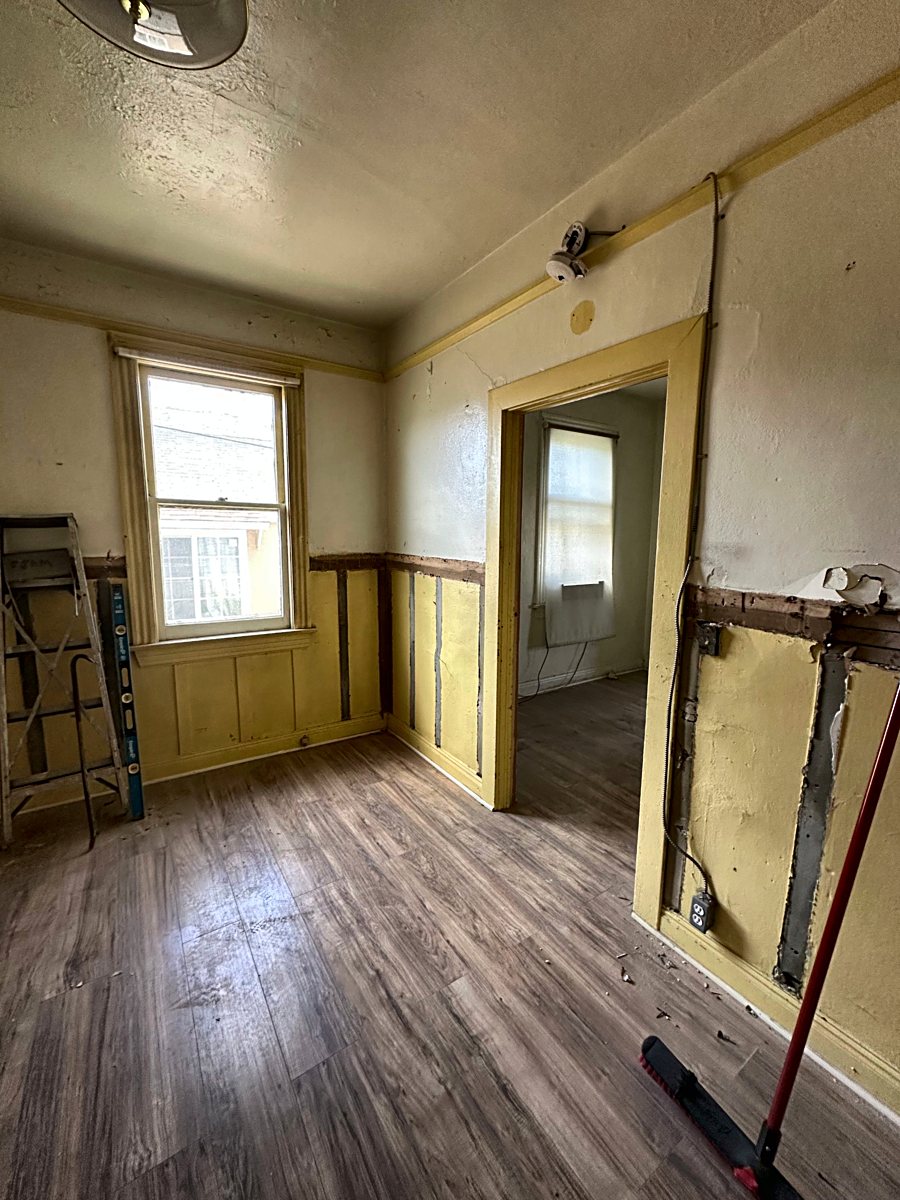 Room 4: exposed wall framing during demolition