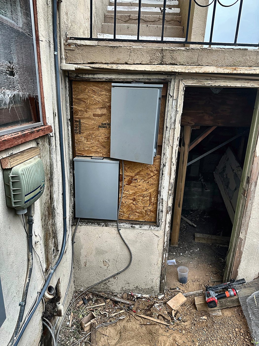 Stairwell wall opening before stucco repair