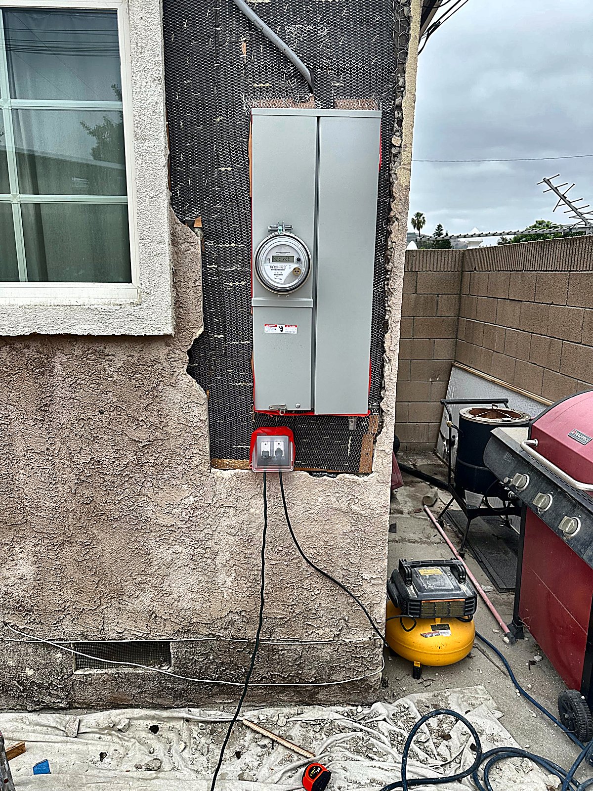 Lath and paper installed on the pink house meter opening