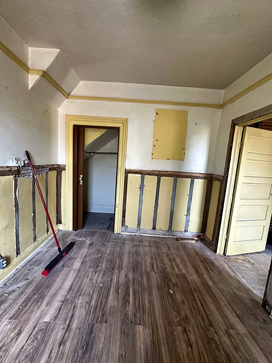 Room 5: exposed wall framing during demolition