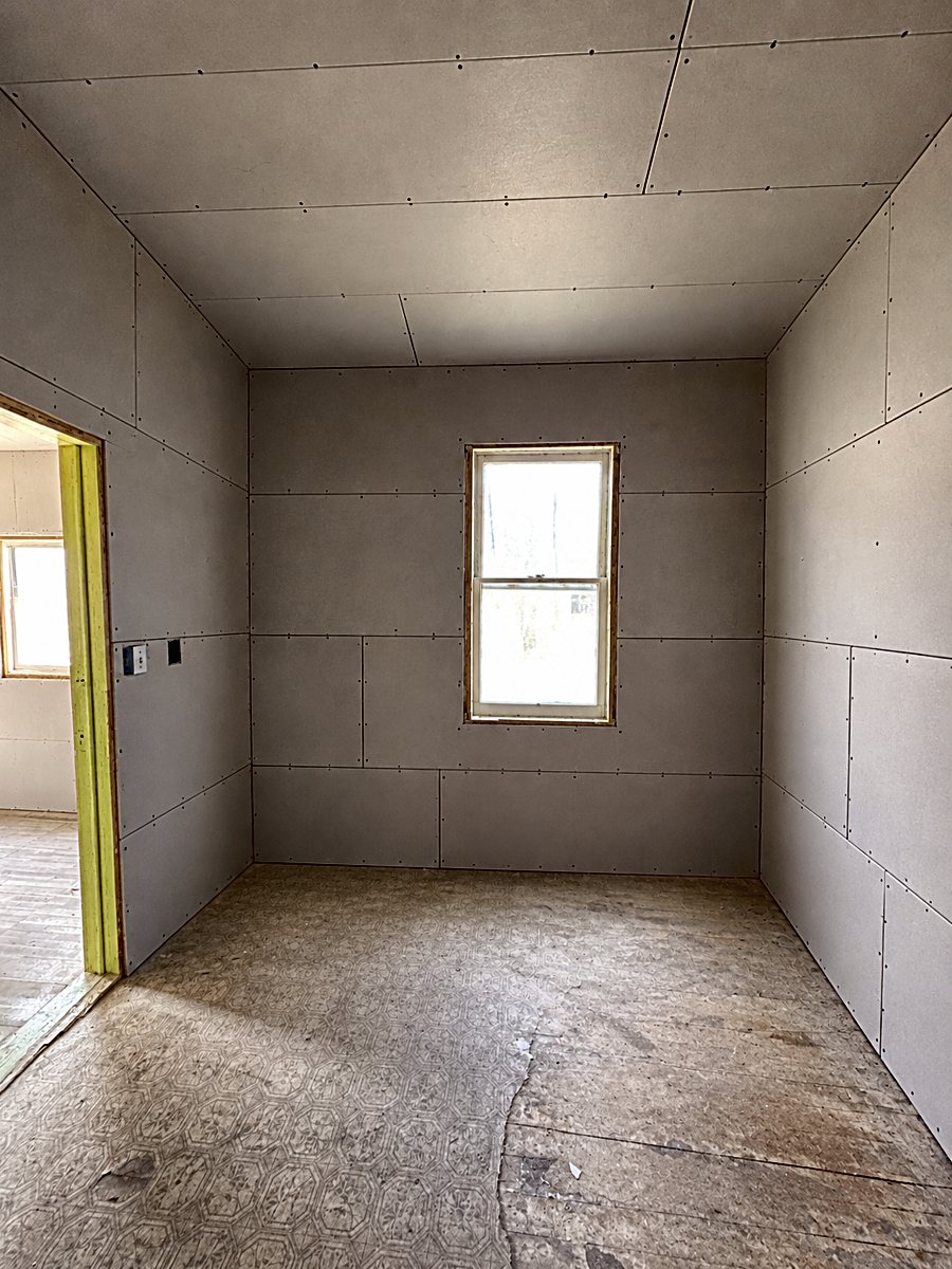 Room 3: installed drywall panels with taped seams
