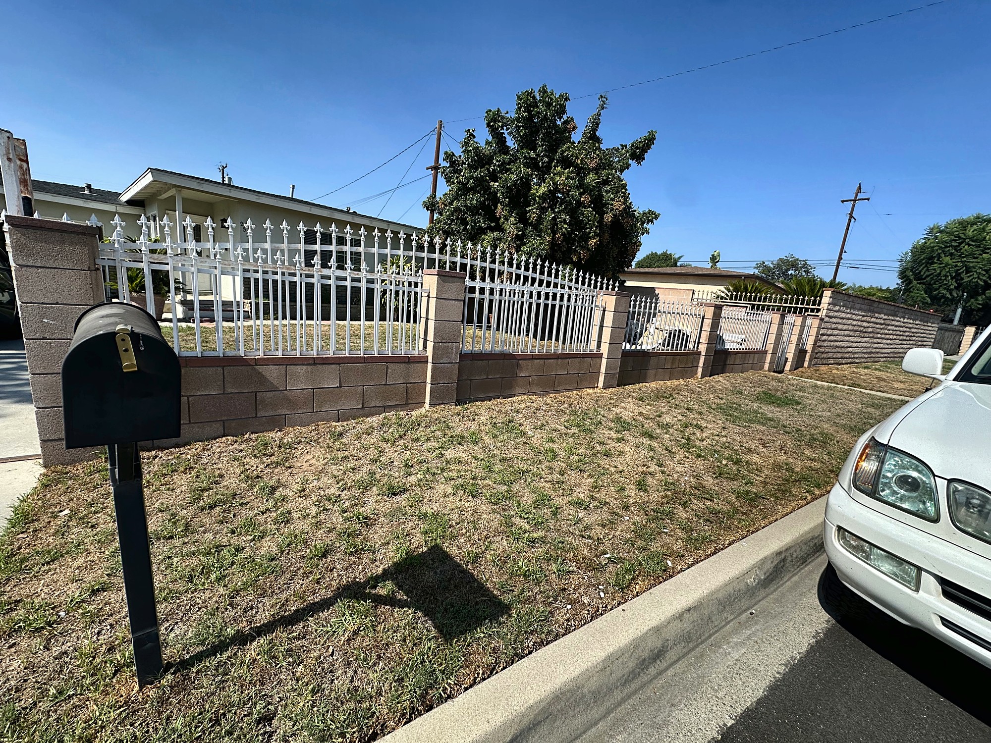 Block wall and iron fence before stucco work