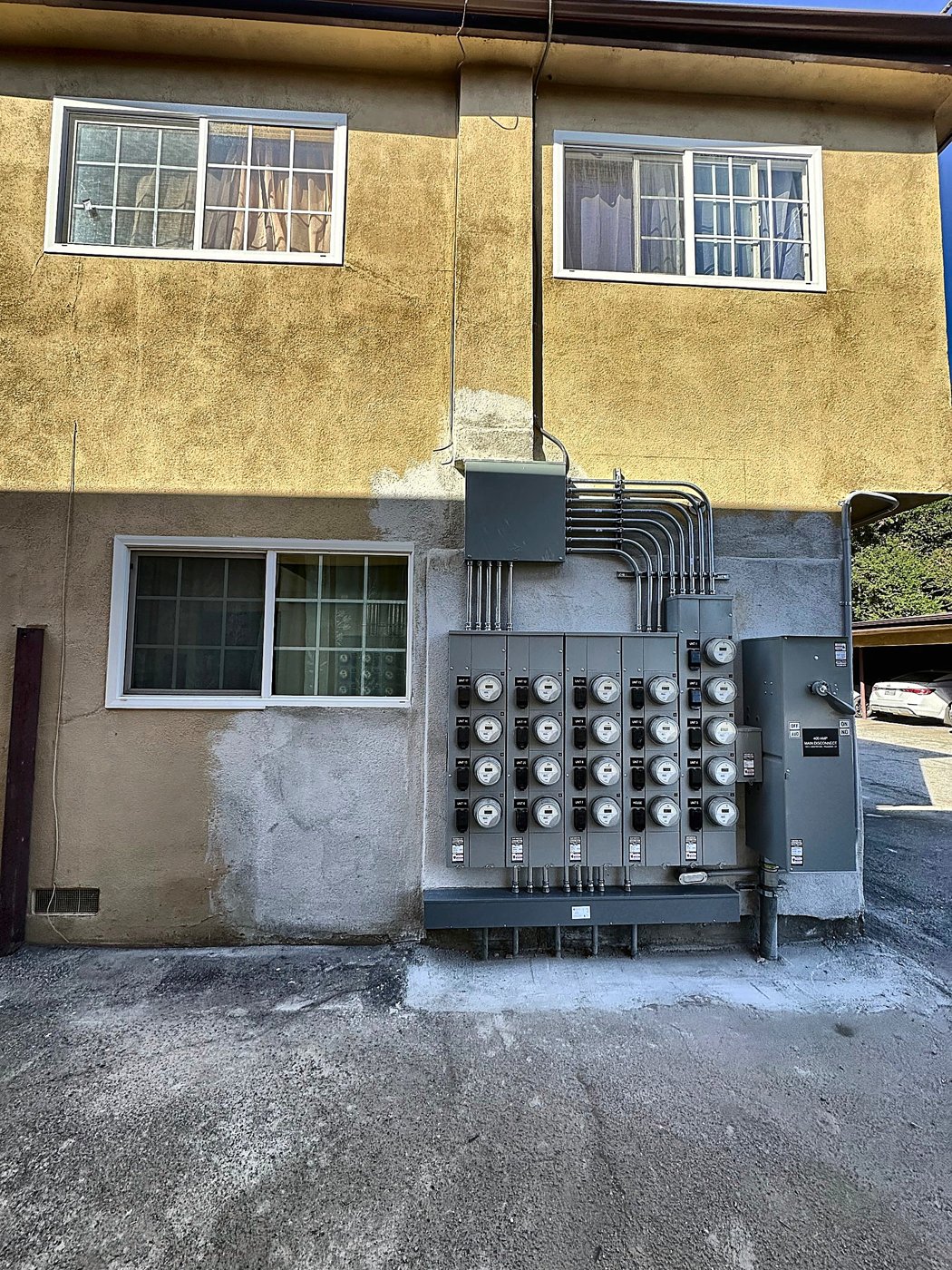 Stucco wall around a meter bank